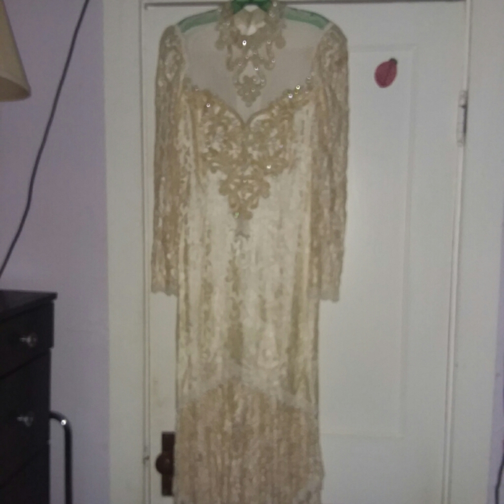 Antique white mid-length formal dress.